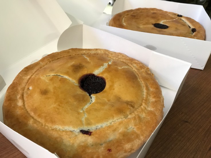 Two Olallieberry Pies Fresh Out of the Oven in Boxes on a Table at Gizdich Ranch