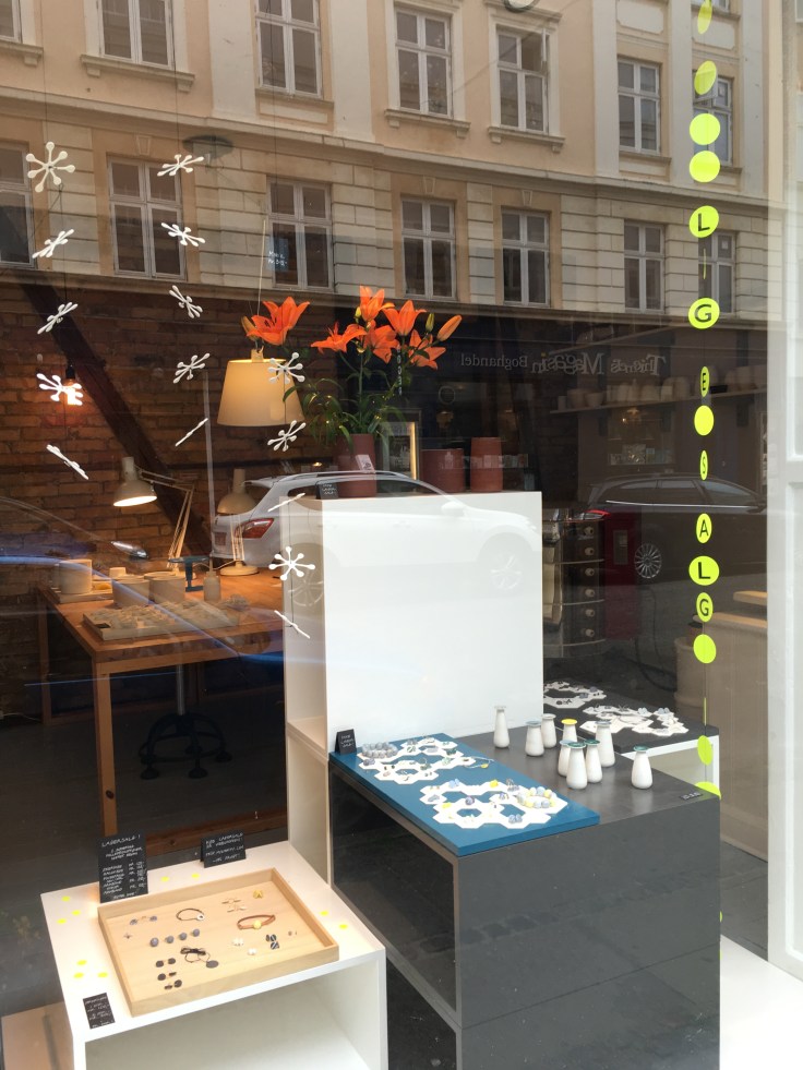 A Window Display at Priip in Copenhagen, Denmark Has Earrings and Little Vases on Display