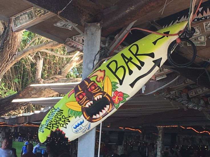 The Sign for The Hungry Tarpon Bar in Islamorada, Florida is a Surf Board with a Bite Out of it