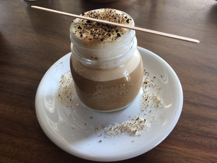 The Salty Donut's Vietnamese Drop Drink - A layered shot of condensed milk combined with Intelligentsia Black Cat Project Espresso was delicately combined with textured milk and then topped with a bit of torched milk and a dash of smoked sea salt in Miami, Florida's Wynwood Art District.