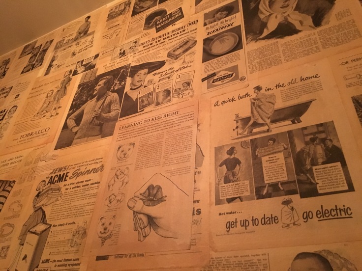 Kiss and Tell - Antique Print Ads and News Articles Decorate the Powder Room at The Chop Shop Food Merchants in Arrowtown, New Zealand