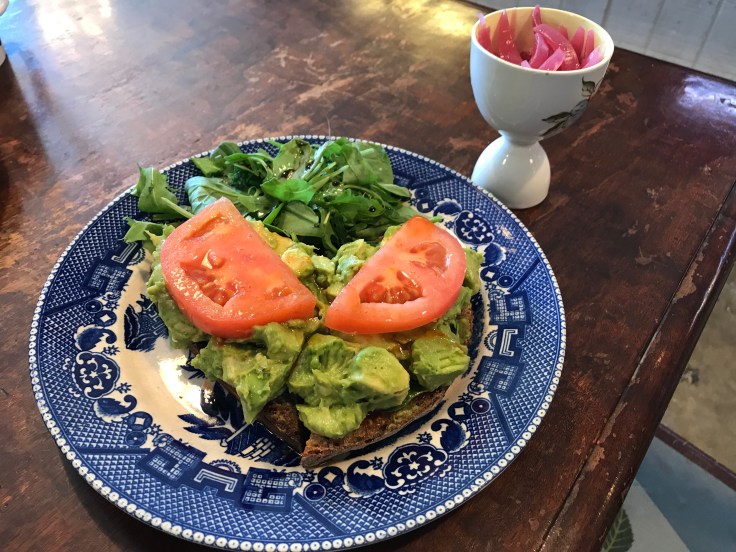 Honey Sriracha Avocado Toast Served on Zak the Baker Bread at Cream Parlor in Miami, Florida