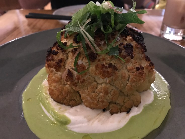 Smokin' - The Roasted Cauliflower Dish Served with Goat Cheese and Shishito Herb Vinaigrette at KYU in Miami, Florida