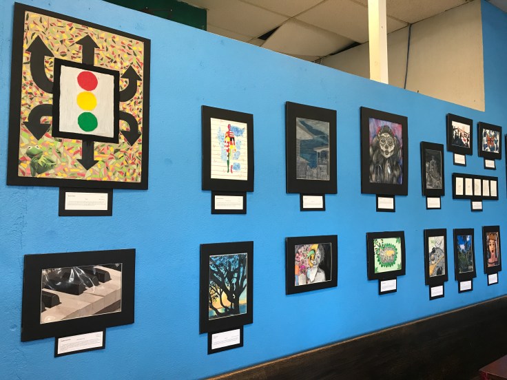 Artwork Designed by the Students of Saint Joseph Notre Dame High School Hangs on the Walls of the Blue Dot Café & Coffee Bar in Alameda, California