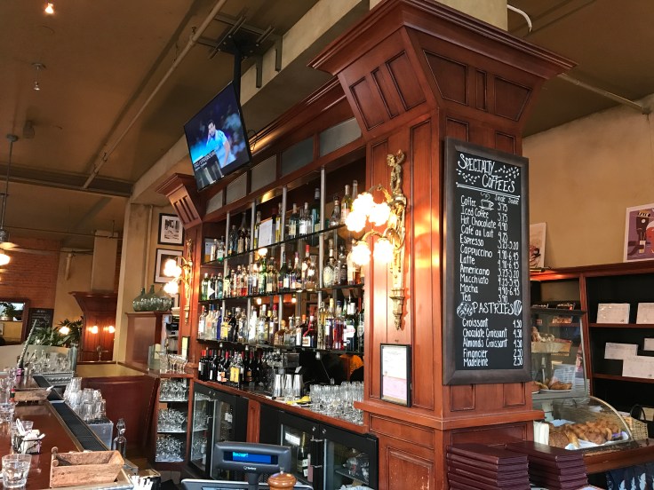 High Bar - One of the Highlights of Café de la Presse in San Francisco, California is its Stunning Alderwood Bar