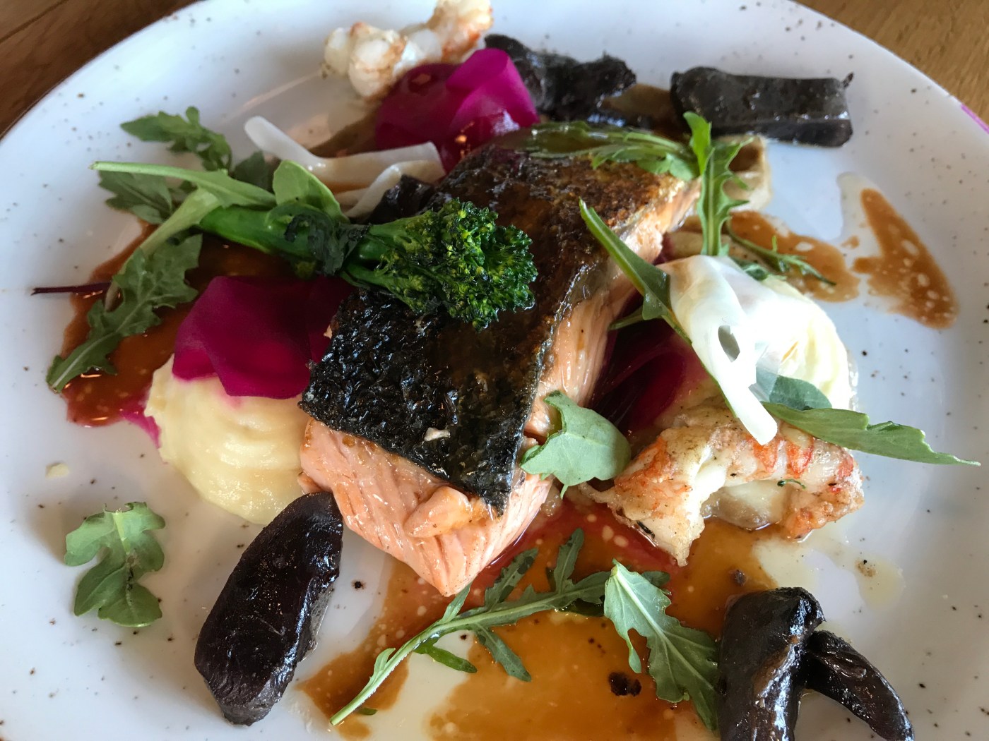 Salmon Served with Baked Asparagus, Icelandic Potatoes, Herb Salad and Yuzu Dressing at Strikið Restaurant in Akureyri, Iceland