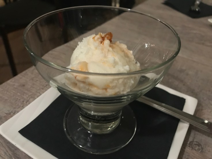 A photo of a scoop of apricot water buffalo gelato at Morsey's Farmhouse Kitchen in Los Altos, California.
