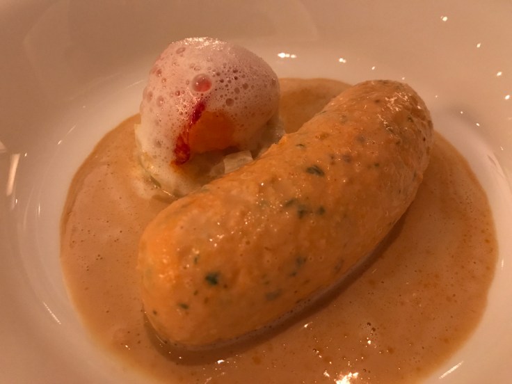 A photo of Le Taillevent's signature dish, boudin de homard bleu (blue lobster sausage).