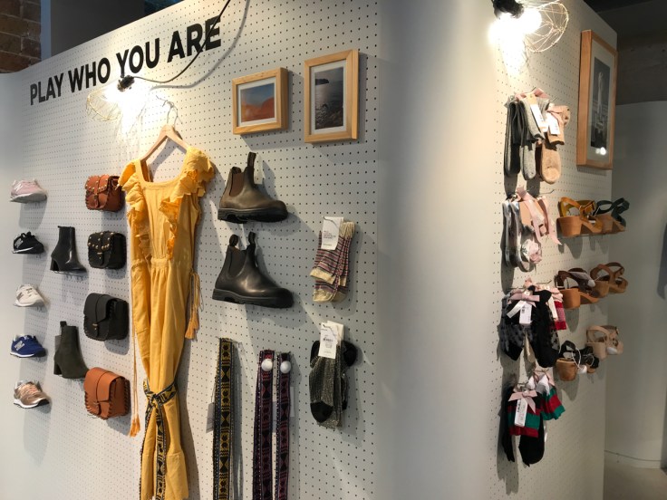A photo of the inside of the Leon &amp; Harper store on Boulevard Beaumarchais in Paris, France. Shoes, socks and dresses are on display and a sign says, "Play who you are."