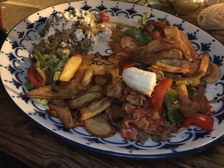 A photo of the house specialty, the #51 shikor patata sga made with sweet potatoes, lamb, spicy tomato sauce, eggplant, carrots, peppers, fresh tomatoes, chili, garlic and sweet banana at Ambiente Africa restaurant in Stuttgart, Germany. (#51 shikor patata sga - süßkartoffeln mit lamm rind oder hühnerfleisch in tomatensoße mit auberginen, karotten, paprika, frischen tomaten, chili, knoblauch und süßer banane)