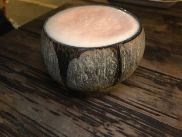 A photo of an African beer with guava in a coconut at Ambiente Africa in Stuttgart, Germany.