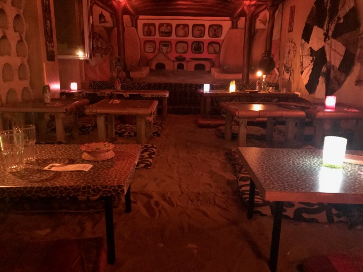 A photo of the sand filled Savannah room with animal print tables and glowing candles at Ambiente Africa in Stuttgart, Germany.