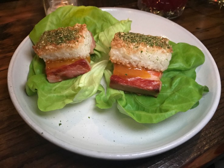 A photo of pork belly made with kimchi, koshihikari rice and bib lettuce at The Snug SF in San Francisco, California.