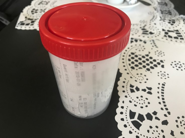 A receipt from a meal at Pharmacia restaurant in Lisbon, Portugal arrives table side tucked into a specimen jar.