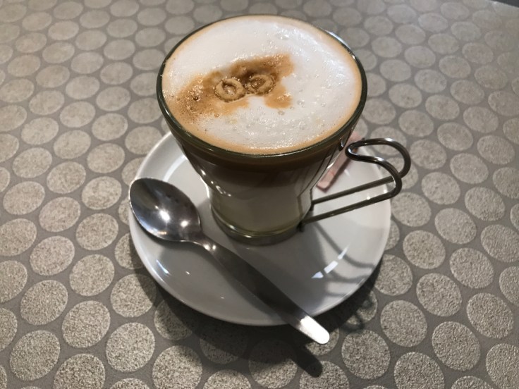 A cup filled with a café bombón at Pop Cereal Café in Porto, Portugal. The restaurant makes the tasty caffeine beverage by adding condensed milk to espresso.