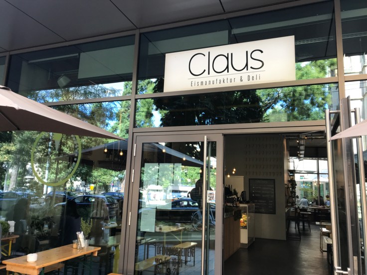 A street view photo of the outside of Claus Eismanufaktur & Deli in Stuttgart, Germany taken from the sidewalk.