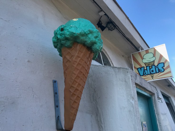 An exterior street view sidewalk shot of the outside of Ísbúðin Valdís ice cream shop in Reykjavík, Iceland via FoodWaterShoes.
