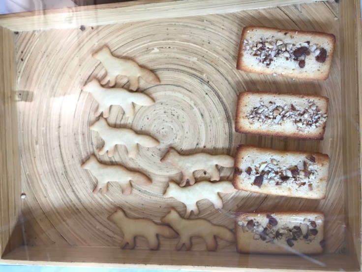 Sablé kitsuné (fox shaped cookies) sit beside and financier yuzu (yuzu flavored almond cakes) at Café Kitsuné, a restaurant in Paris, France. Photo Courtesy of FoodWaterShoes