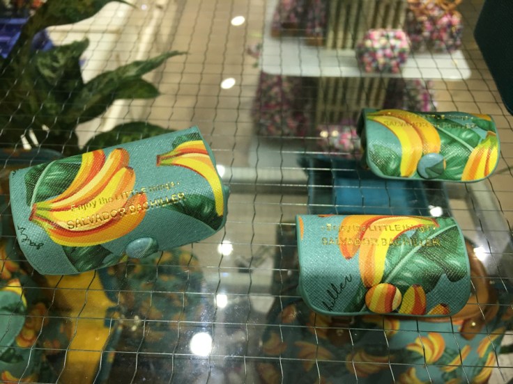 Banana print leather goods and small accessories at Salvador Bachiller in Madrid, Spain. The pill and lipstick cases are bright blue with an adorable yellow banana print on them.