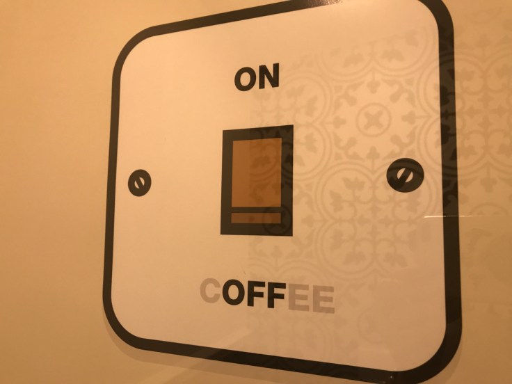 A cute sign at Ciekawa Słodko-Słono's coffee and ice cream shop in Tarnów, Poland says, "On, Off, Coffee."