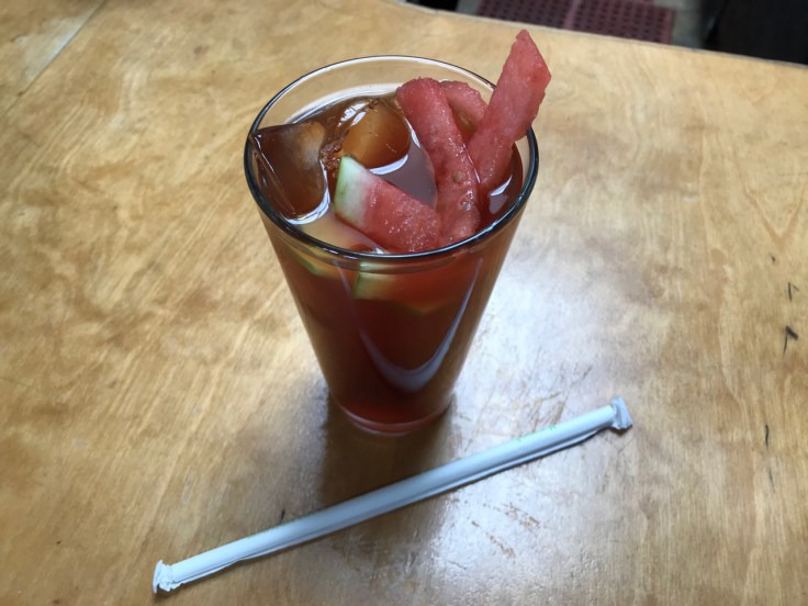 A glass of watermelon sweet tea filled with watermelon slices at Brenda's Meat & Three breakfast and brunch restaurant in San Francisco, California.