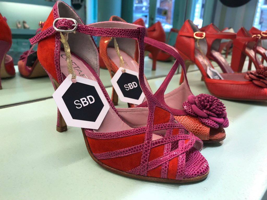 A photo of lovely strappy red and pink tango high heels at the GretaFlora shoe shop in Buenos Aires, Argentina. If you're interested in fashion and stiletto shopping in Buenos Aires, this is one boutique you won't want to miss. Photo Courtesy of FoodWaterShoes