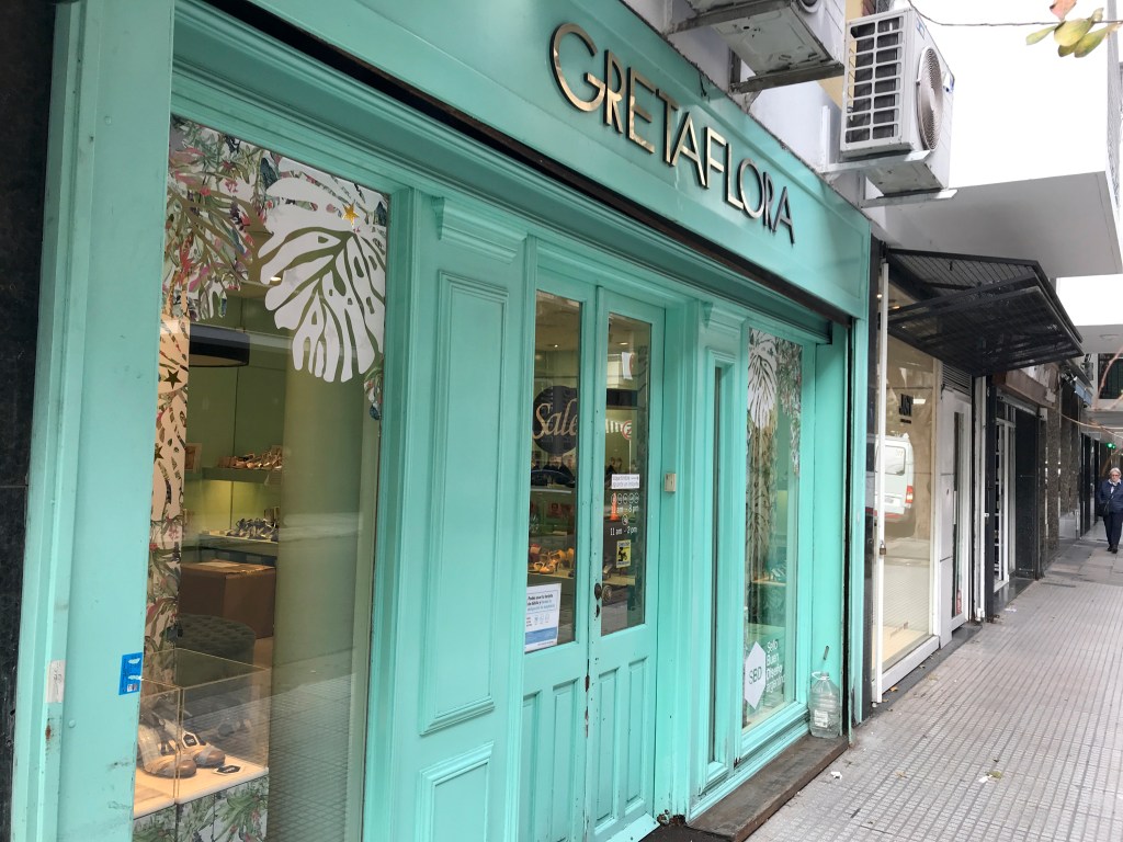 A photo of the front door to GretaFlora, a tango shoe store in Buenos Aires, Argentina. The photo is of the exterior / is an outside street view shot of the high heel specialty boutique. Photo Courtesy of FoodWaterShoes