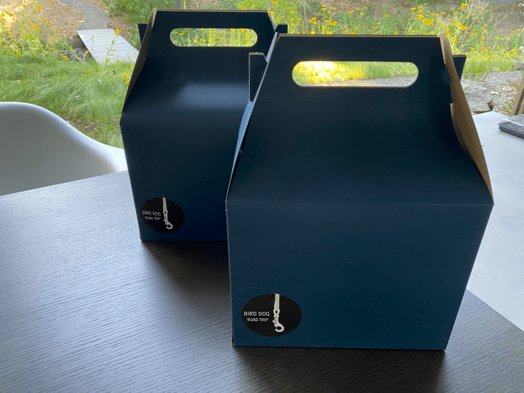 A photo of two blue cardboard boxes containing the Hokkaido weekend bundle from Bird Dog in Palo Alto, California. The local little Bay Area restaurant is doing takeout in Silicon Valley during coronavirus pandemic. Photo Courtesy of FoodWaterShoes