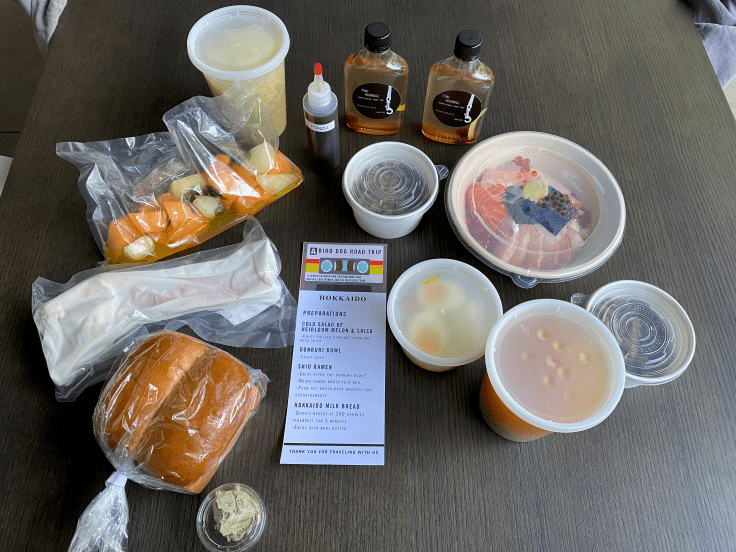 A photo of takeout containers and prep instructions from Bird Dog, a cute restaurant in Palo Alto, California. The local little Bay Area restaurant is doing takeout in Silicon Valley during coronavirus pandemic. Photo Courtesy of FoodWaterShoes