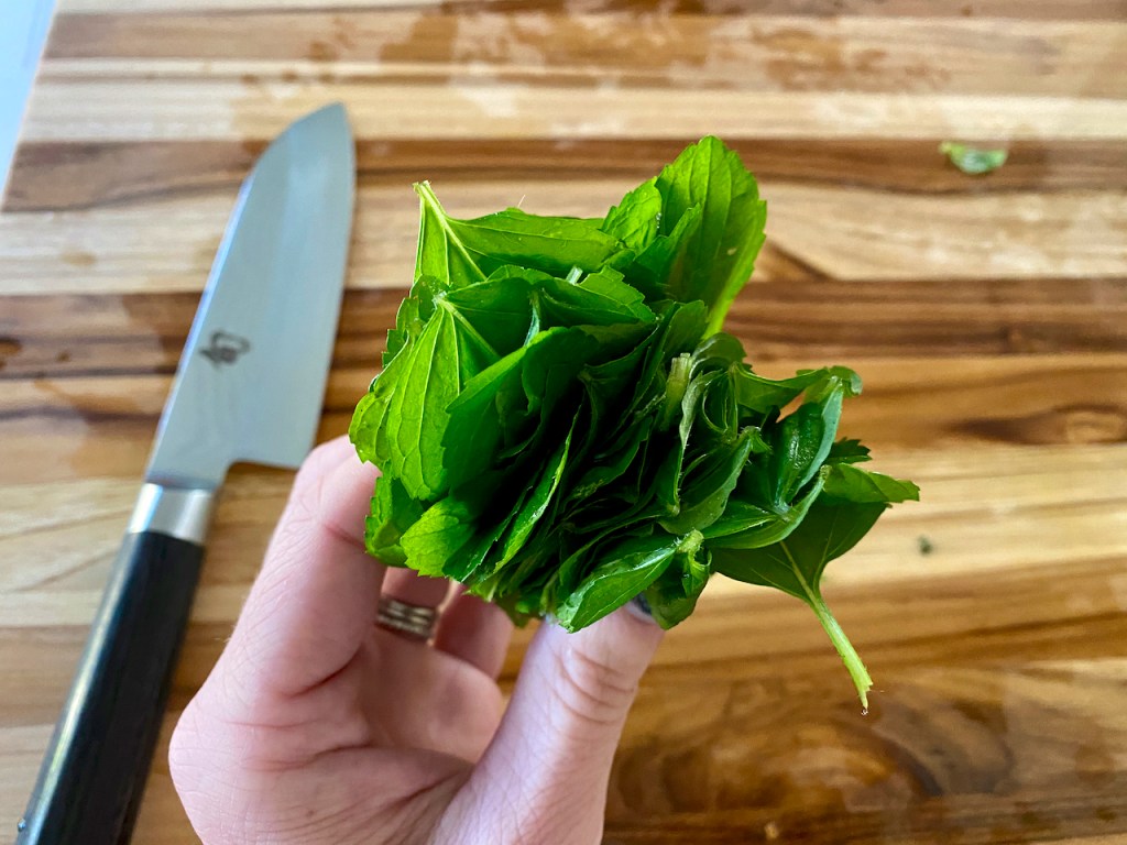 A stack of fresh wild mint leaves prepped for chiffonade. Photo Courtesy of FoodWaterShoes